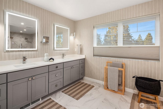 10419 41st Ave SW Unit A, Seattle, WA 98146 - full bath with double vanity, a shower, marble look tiles, and baseboards