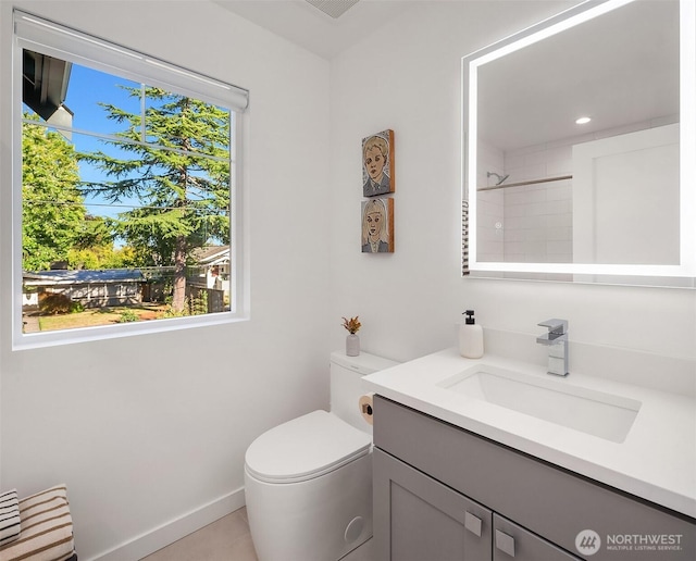10419 41st Ave SW Unit A, Seattle, WA 98146 - full bathroom featuring vanity, toilet, a shower, baseboards, and recessed lighting