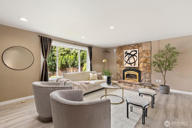 13832 146th Pl SE, Renton, WA 98059 - living room with light wood-style flooring, baseboards, a fireplace, and recessed lighting