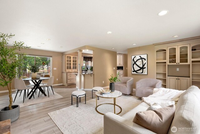 13832 146th Pl SE, Renton, WA 98059 - living room with decorative columns, light wood-style floors, baseboards, and recessed lighting