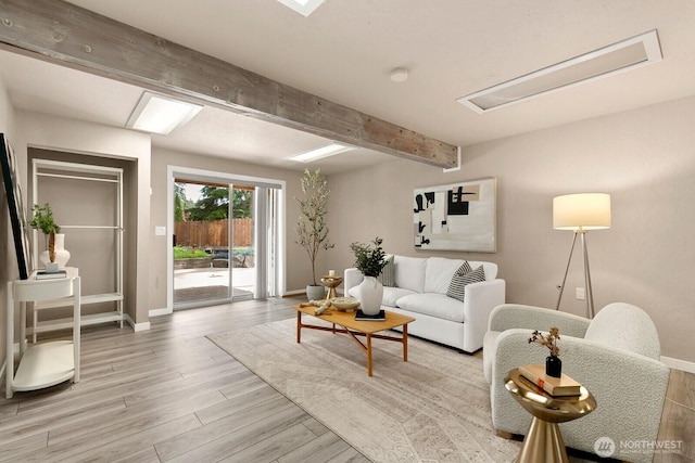 13832 146th Pl SE, Renton, WA 98059 - living room with beam ceiling, baseboards, light wood-style floors, and attic access