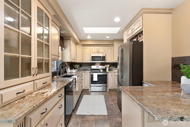 13832 146th Pl SE, Renton, WA 98059 - kitchen with stainless steel appliances, a sink, a skylight, tasteful backsplash, and glass insert cabinets