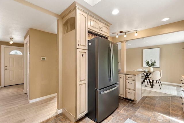 13832 146th Pl SE, Renton, WA 98059 - kitchen featuring freestanding refrigerator, baseboards, light stone countertops, decorative columns, and recessed lighting