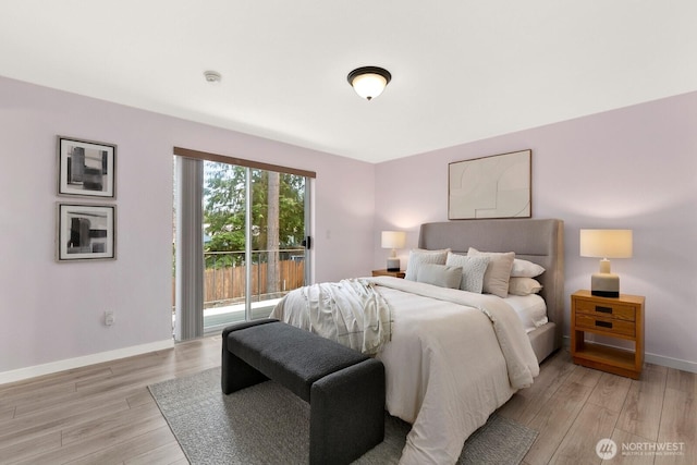 13832 146th Pl SE, Renton, WA 98059 - bedroom with access to outside, light wood-style flooring, and baseboards