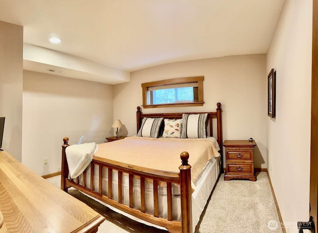 bedroom with light colored carpet, baseboards, and recessed lighting