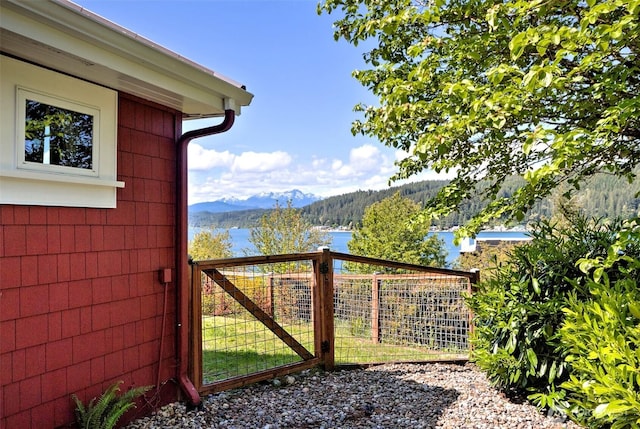 8820 E State Route 106, Union, WA 98592 - gate featuring a mountain view and fence