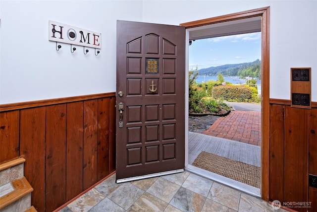 8820 E State Route 106, Union, WA 98592 - entryway with wainscoting, wood walls, and a water view