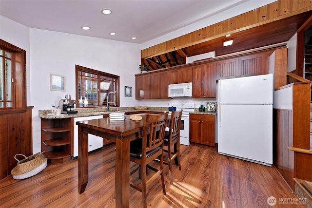 8820 E State Route 106, Union, WA 98592 - kitchen with white appliances, open shelves, wood finished floors, recessed lighting, and light stone counters