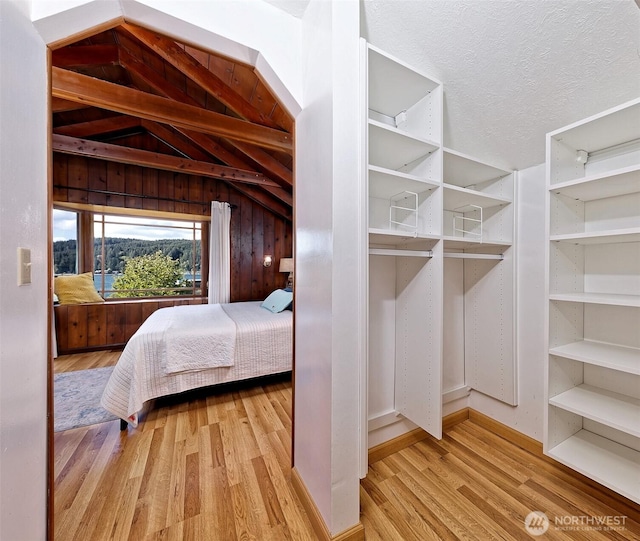 8820 E State Route 106, Union, WA 98592 - bedroom featuring wood finished floors and lofted ceiling