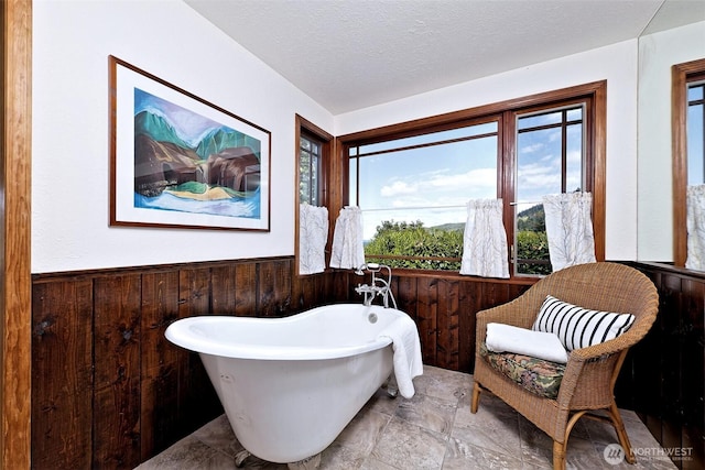 8820 E State Route 106, Union, WA 98592 - full bath with wood walls, wainscoting, and a soaking tub