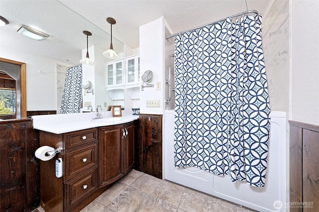 8820 E State Route 106, Union, WA 98592 - full bathroom featuring wainscoting, shower / tub combo with curtain, vanity, and a textured ceiling