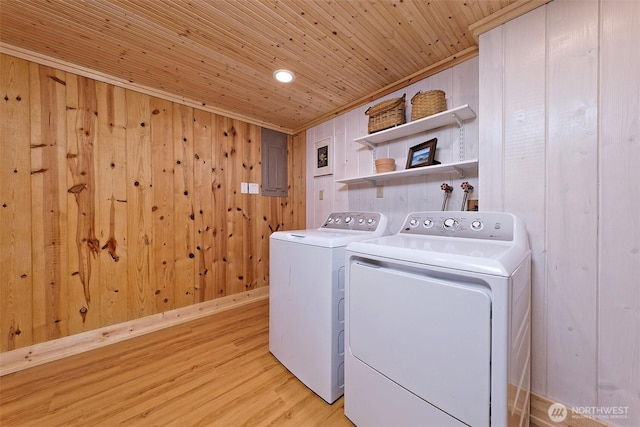 8820 E State Route 106, Union, WA 98592 - washroom with washer and dryer, light wood-style flooring, wood walls, electric panel, and wooden ceiling
