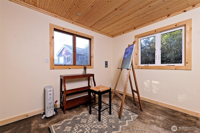 8820 E State Route 106, Union, WA 98592 - interior space with unfinished concrete floors, wood ceiling, healthy amount of natural light, and baseboards