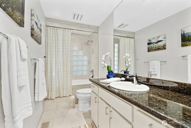 21010 NE 33rd Pl, Sammamish, WA 98074 - bathroom featuring toilet, tiled shower / bath, vanity, and tile patterned floors