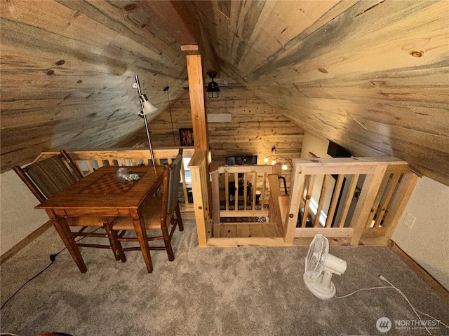 22415 Stirrup Rd, Leavenworth, WA 98826 - carpeted dining space featuring vaulted ceiling, wood walls, and wood ceiling