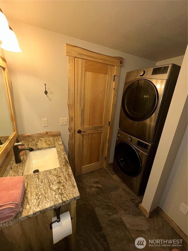 22415 Stirrup Rd, Leavenworth, WA 98826 - washroom with stacked washer / drying machine and baseboards