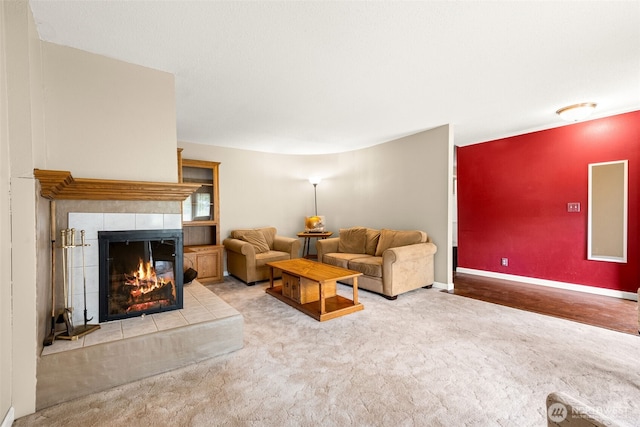 5102 23rd Ave SE, Lacey, WA 98503 - carpeted living area featuring a fireplace and baseboards