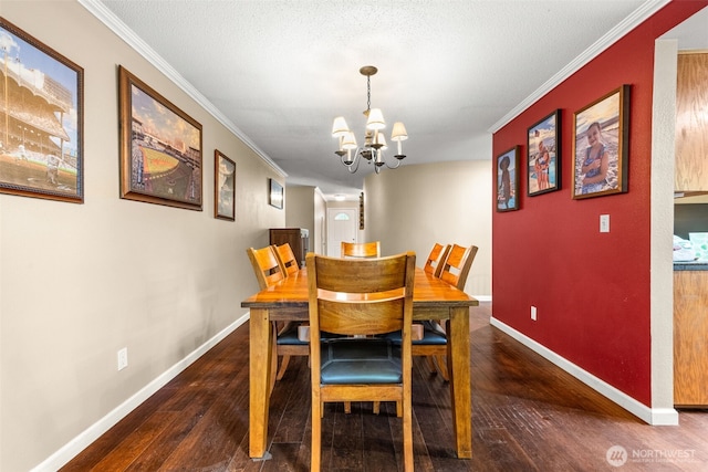 5102 23rd Ave SE, Lacey, WA 98503 - dining space featuring a chandelier, hardwood / wood-style flooring, crown molding, and baseboards