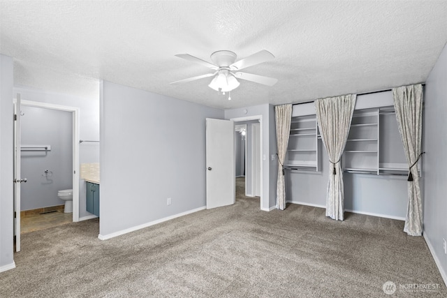 12608 SE Mcgillivray Blvd, Vancouver, WA 98683 - unfurnished bedroom with carpet flooring, a textured ceiling, ensuite bath, and baseboards