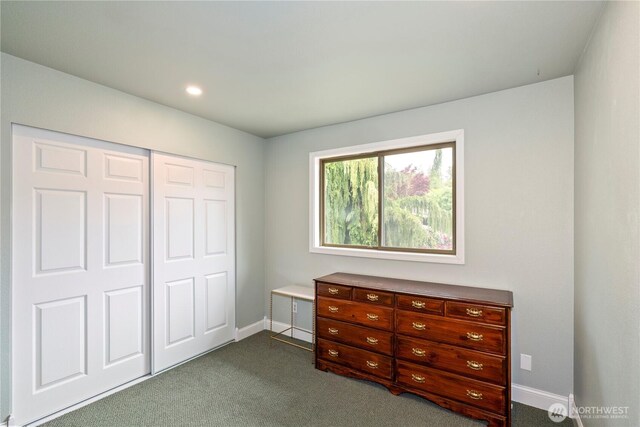 bedroom with dark carpet, baseboards, a closet, and recessed lighting