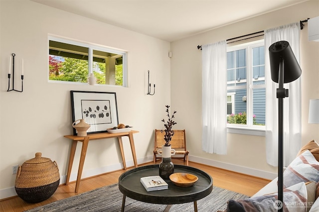 1748 25th Walk NE, Issaquah, WA 98029 - sitting room featuring wood finished floors, healthy amount of natural light, and baseboards