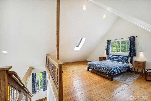 1465 Magnolia Ln, Camano Island, WA 98282 - bedroom featuring a skylight, vaulted ceiling, and hardwood / wood-style floors