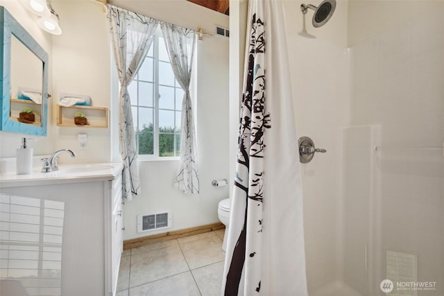 1465 Magnolia Ln, Camano Island, WA 98282 - bathroom with a shower with shower curtain, toilet, tile patterned floors, vanity, and baseboards