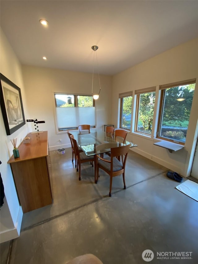 11191 Valley Heights Cir NE, Bainbridge Island, WA 98110 - dining room featuring baseboards, concrete floors, and recessed lighting