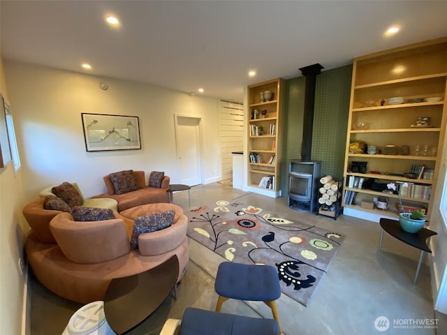 11191 Valley Heights Cir NE, Bainbridge Island, WA 98110 - living area with a wood stove, recessed lighting, finished concrete flooring, and built in features