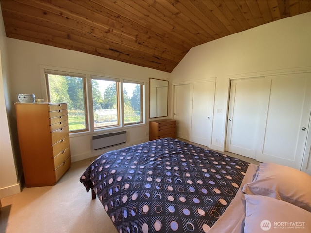 11191 Valley Heights Cir NE, Bainbridge Island, WA 98110 - bedroom featuring multiple closets, wooden ceiling, a wall mounted air conditioner, vaulted ceiling, and light carpet