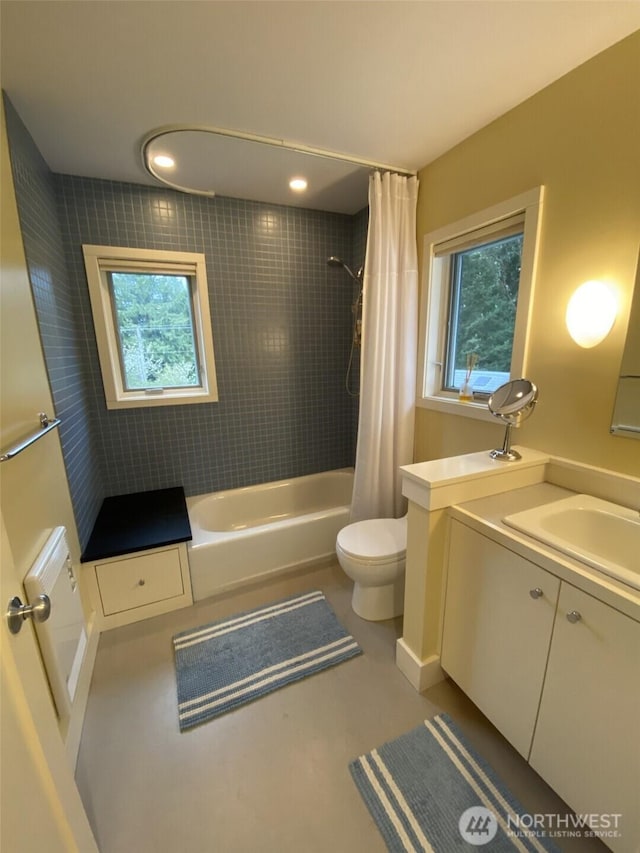 11191 Valley Heights Cir NE, Bainbridge Island, WA 98110 - bathroom featuring toilet, shower / bath combo with shower curtain, and vanity
