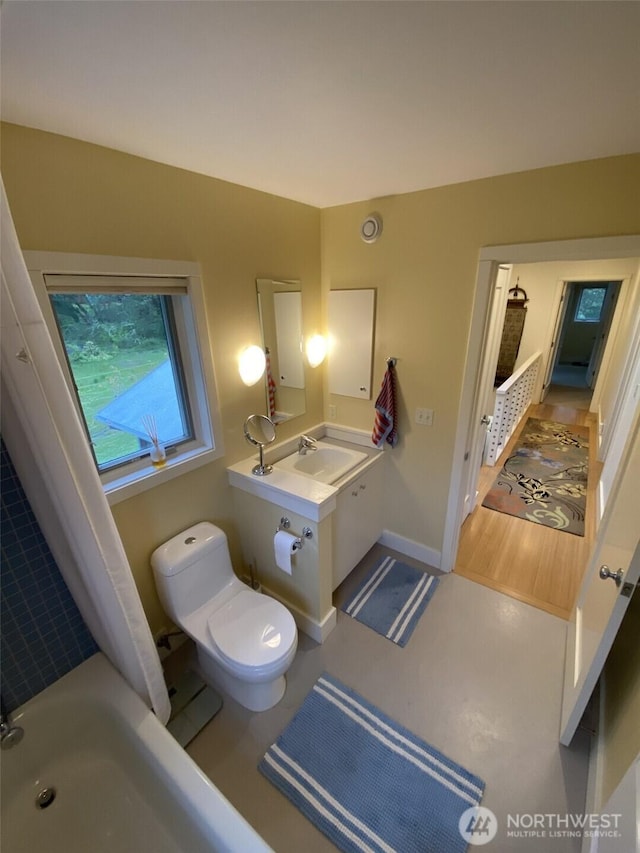 11191 Valley Heights Cir NE, Bainbridge Island, WA 98110 - full bath with baseboards, toilet, and vanity