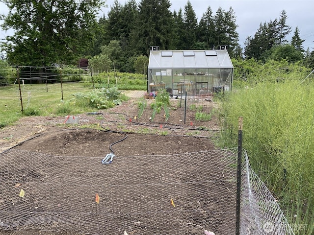 11191 Valley Heights Cir NE, Bainbridge Island, WA 98110 - view of yard with a greenhouse, an outbuilding, and a vegetable garden