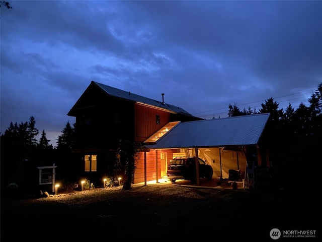 11191 Valley Heights Cir NE, Bainbridge Island, WA 98110 - back of property featuring dirt driveway, metal roof, and a carport