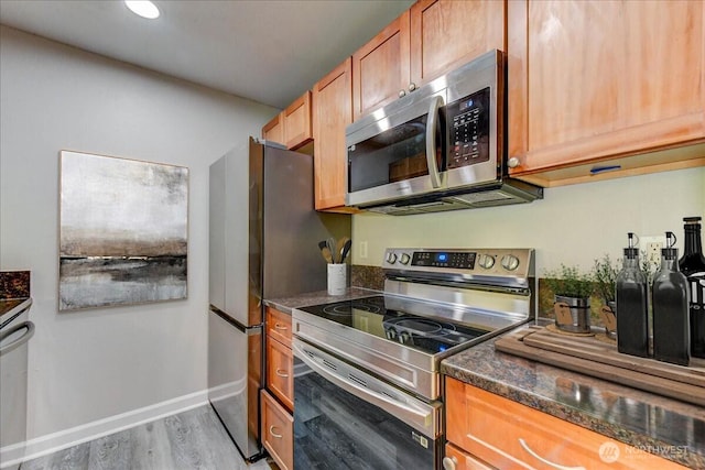 10826 NE 148th Ln Unit H201, Bothell, WA 98011 - kitchen with appliances with stainless steel finishes, light wood-style flooring, baseboards, and recessed lighting