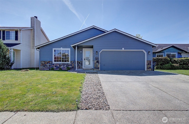 view of front of property featuring an attached garage, concrete driveway, a front yard, and stone siding