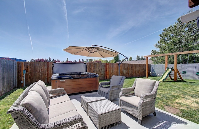 view of patio / terrace with outdoor lounge area, a playground, and a hot tub