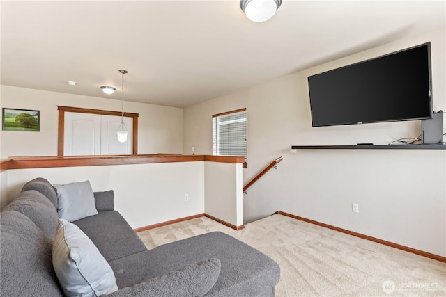 living area with carpet and baseboards