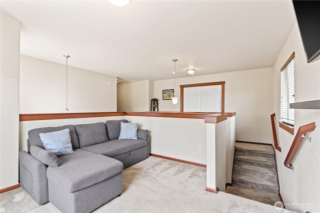 living room featuring baseboards and carpet flooring