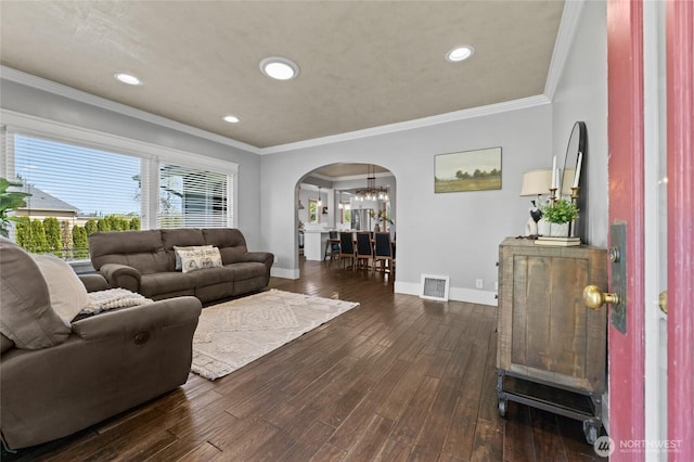 256 S C St, Buckley, WA 98321 - living room with arched walkways, baseboards, dark wood-style floors, recessed lighting, and crown molding