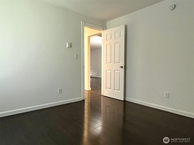 14760 NE 31st St Unit A308, Bellevue, WA 98007 - unfurnished room featuring wood finished floors and baseboards