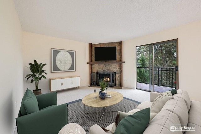 12525 NE 145th Pl Unit F105, Kirkland, WA 98034 - carpeted living room featuring a stone fireplace