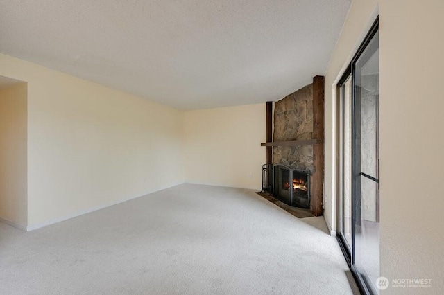 12525 NE 145th Pl Unit F105, Kirkland, WA 98034 - unfurnished living room featuring carpet flooring and a fireplace