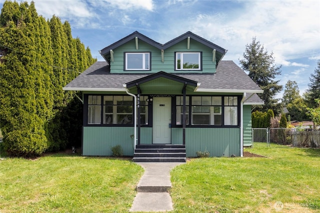 6835 S I St, Tacoma, WA 98408 - bungalow-style house featuring roof with shingles, a sunroom, and entry steps