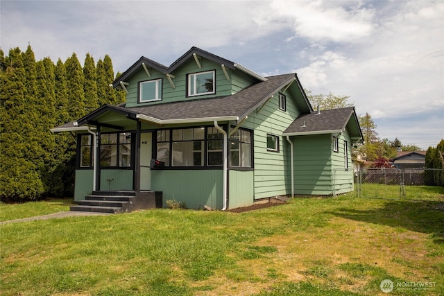 6835 S I St, Tacoma, WA 98408 - view of front of house featuring entry steps, roof with shingles, a sunroom, and a gate