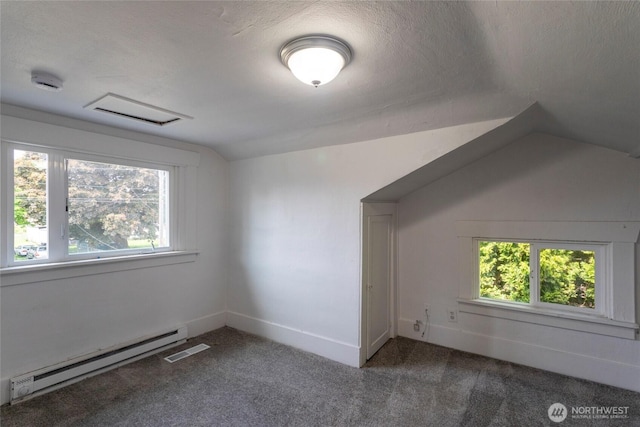 6835 S I St, Tacoma, WA 98408 - additional living space with a baseboard radiator, vaulted ceiling, healthy amount of natural light, carpet floors, and a textured ceiling