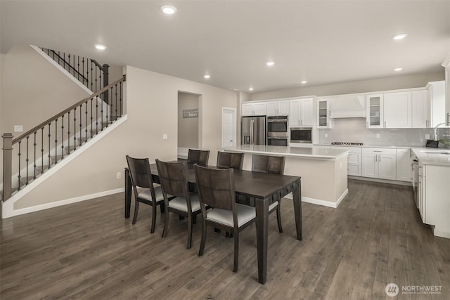 dining room with dark wood-style floors, stairway, recessed lighting, and baseboards