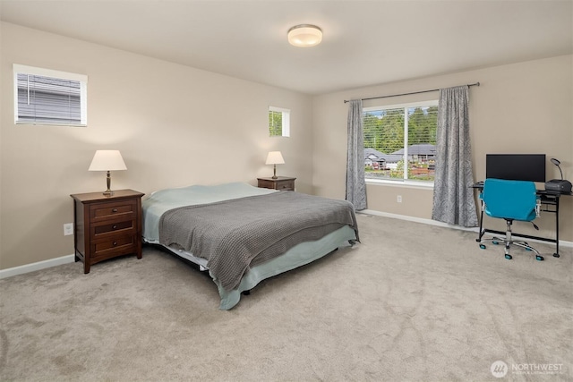 carpeted bedroom with baseboards