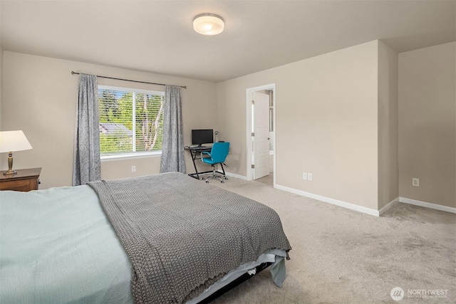 bedroom with baseboards and light colored carpet