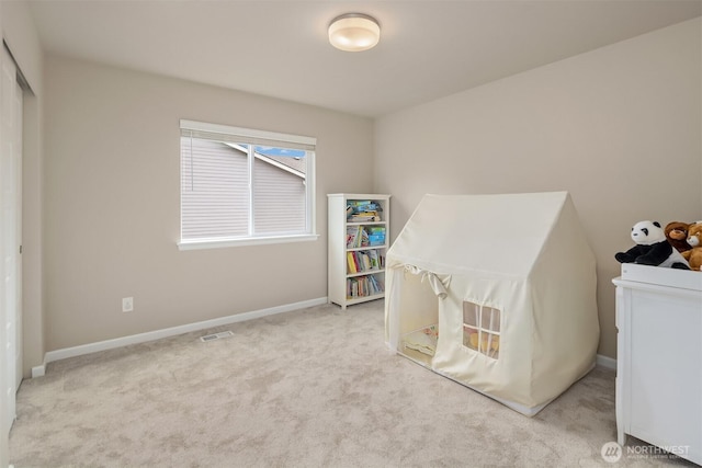 carpeted bedroom with baseboards